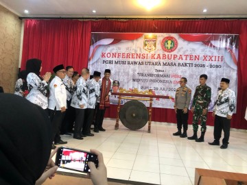 Babinsa Koramil 406-03/Rupit Hadiri Konferensi PGRI Muratara ke-XXI